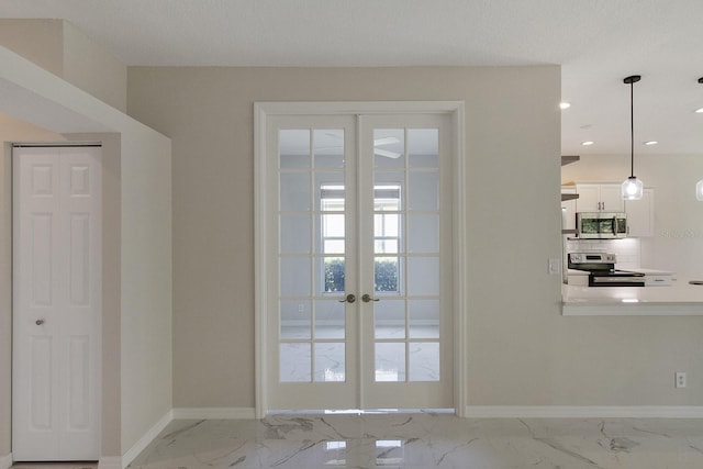 doorway with tile flooring and french doors