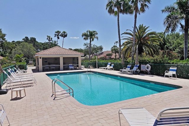 view of swimming pool with a patio area