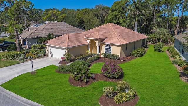 view of front of home featuring a front yard and a garage