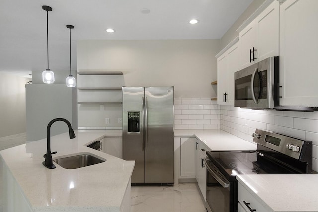 kitchen with sink, tasteful backsplash, light tile flooring, decorative light fixtures, and stainless steel appliances