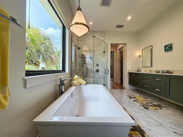 bathroom with plus walk in shower and dual bowl vanity