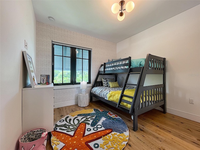 bedroom with hardwood / wood-style flooring