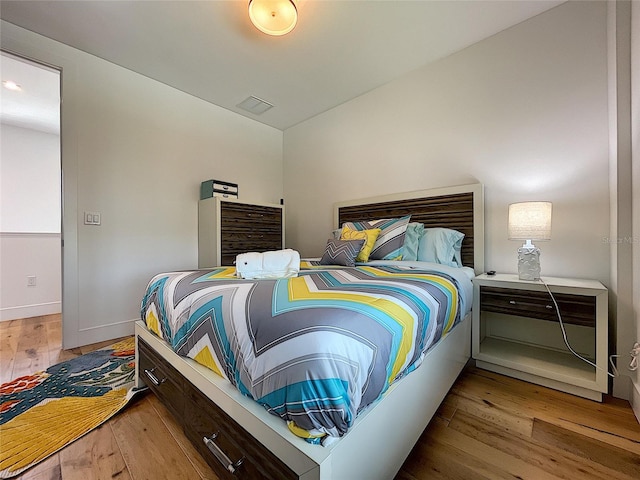 bedroom with light hardwood / wood-style flooring