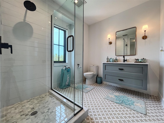 bathroom featuring an enclosed shower, toilet, oversized vanity, and tile floors