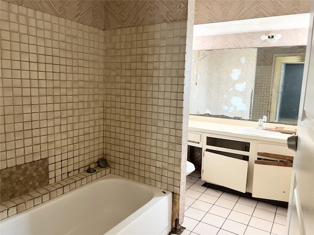 bathroom with tiled shower / bath, vanity, and tile floors