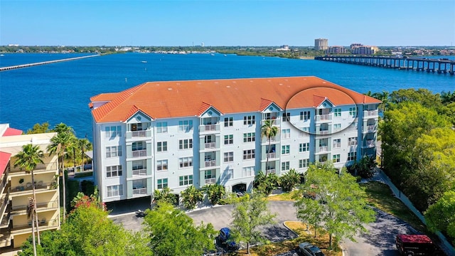 birds eye view of property with a water view