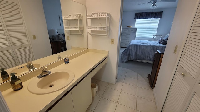 bathroom with vanity, ceiling fan, and tile patterned flooring