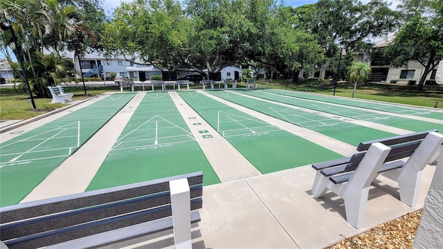 view of property's community with a lawn