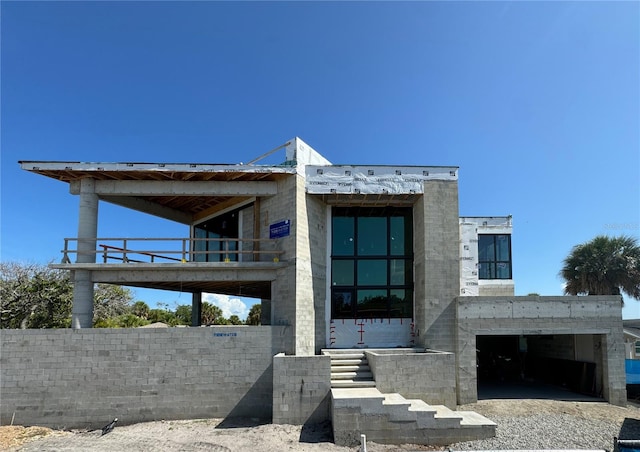 view of front of home with a balcony