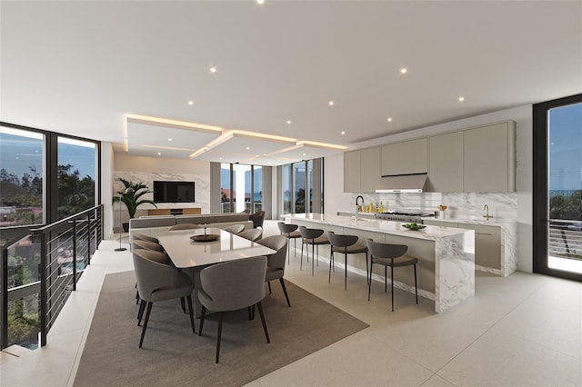 dining area with floor to ceiling windows and a wealth of natural light