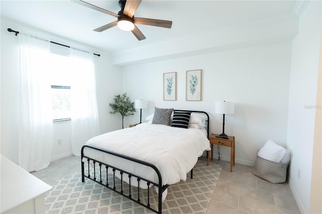 bedroom featuring crown molding, tile floors, and ceiling fan