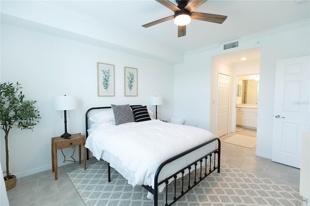 tiled bedroom with ensuite bath, ceiling fan, and crown molding