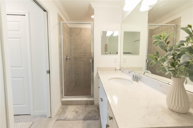 bathroom with crown molding, a shower with shower door, oversized vanity, and tile floors