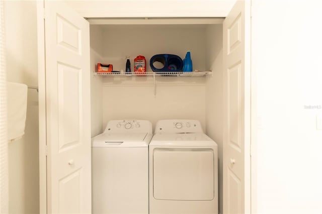 washroom with separate washer and dryer