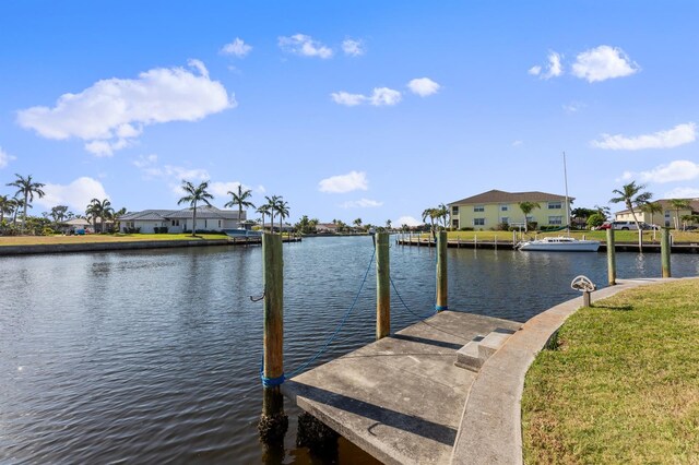 dock area featuring a yard and a water view