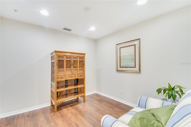 sitting room featuring hardwood / wood-style flooring