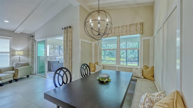 tiled dining space with high vaulted ceiling, beam ceiling, a wealth of natural light, and an inviting chandelier