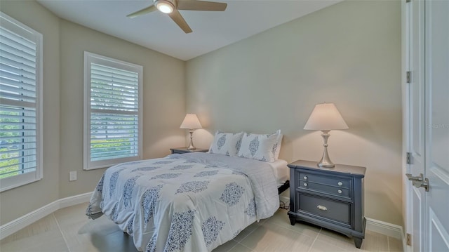 tiled bedroom with ceiling fan