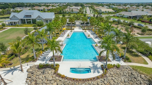 view of pool with a patio and a jacuzzi