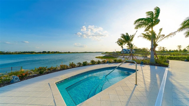 view of pool with a water view