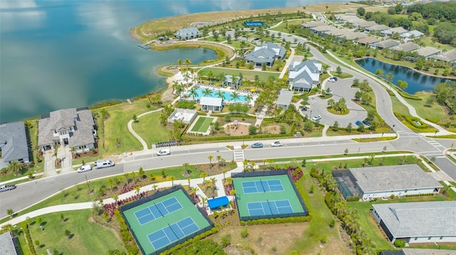 birds eye view of property with a water view