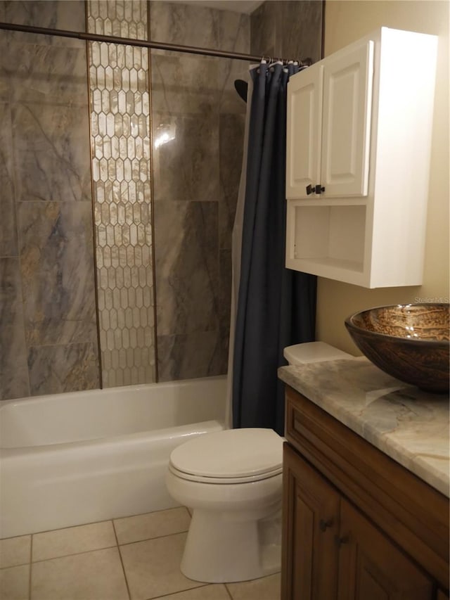 full bathroom featuring tile patterned flooring, shower / bath combo, toilet, and vanity