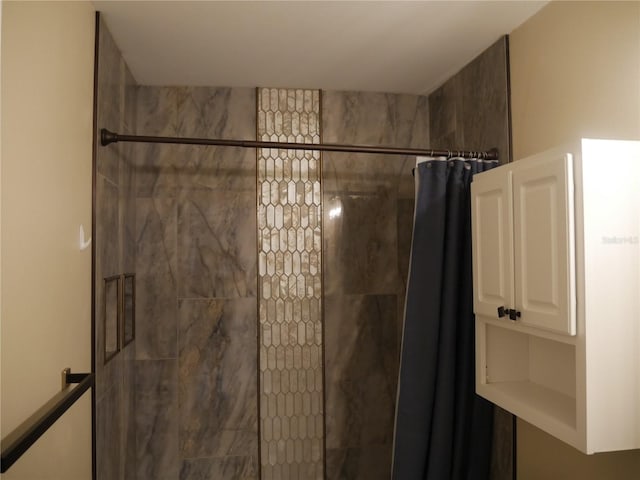 bathroom with a shower with shower curtain