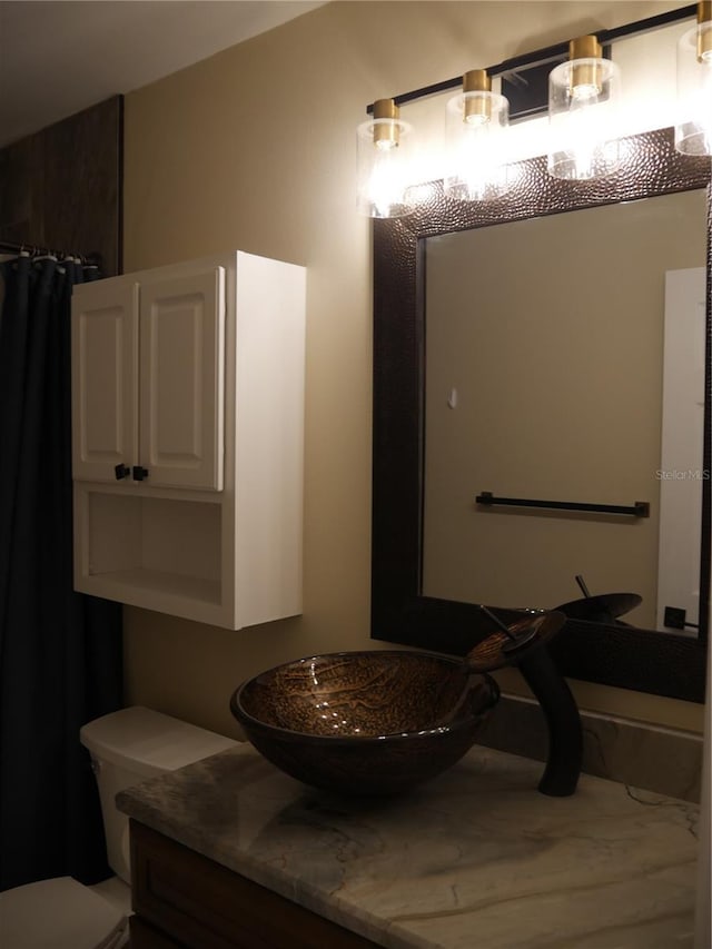 bathroom with vanity and toilet