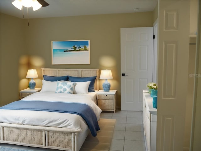 bedroom featuring light tile patterned floors and ceiling fan