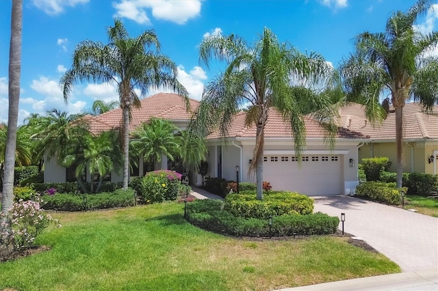 mediterranean / spanish home featuring a front yard