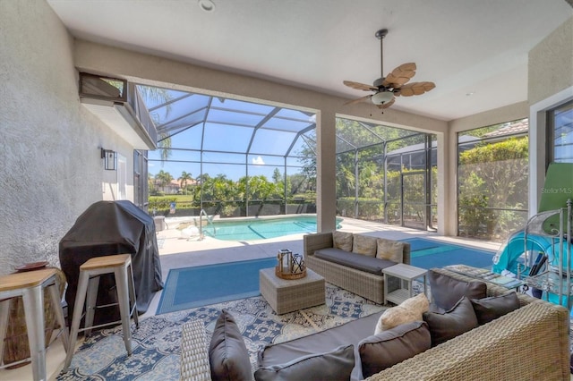 sunroom with lofted ceiling and ceiling fan