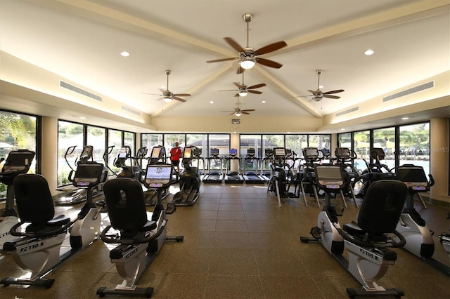 exercise room featuring ceiling fan and high vaulted ceiling