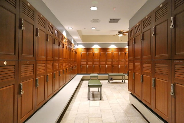 interior space with ceiling fan