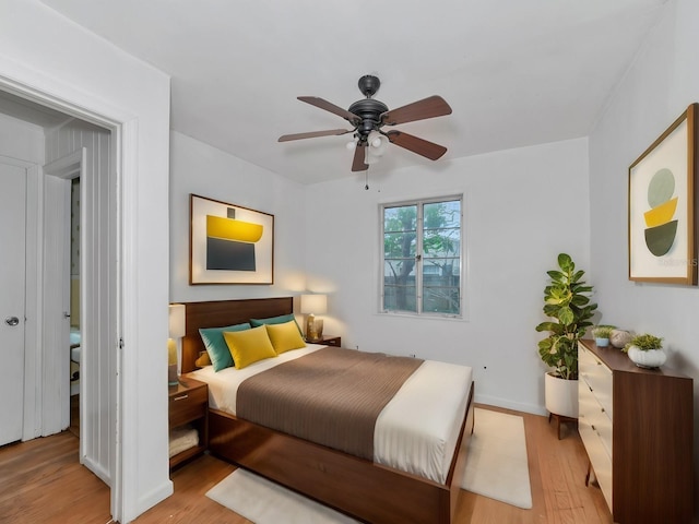 bedroom featuring ceiling fan and light hardwood / wood-style floors