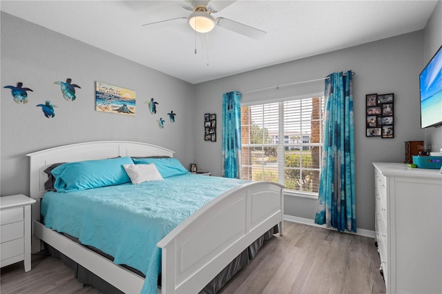 bedroom featuring ceiling fan and light hardwood / wood-style flooring