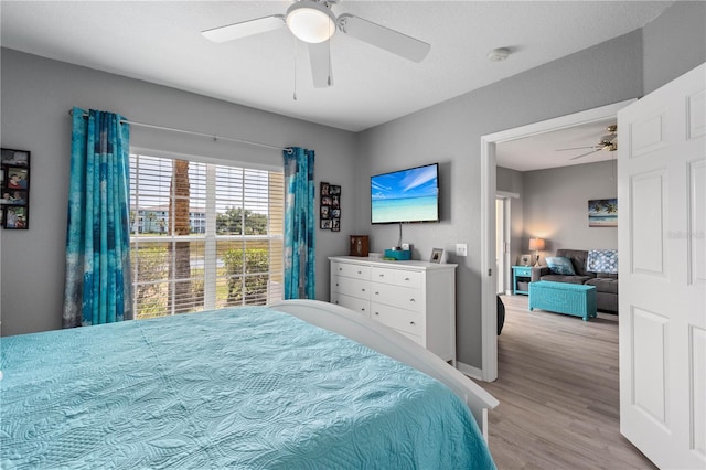 bedroom featuring ceiling fan and hardwood / wood-style flooring