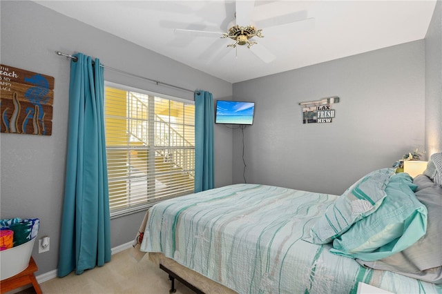 bedroom with ceiling fan and carpet floors