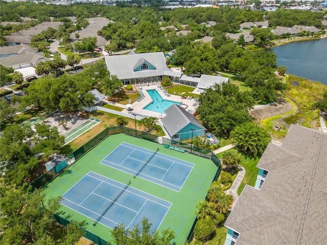 birds eye view of property with a water view