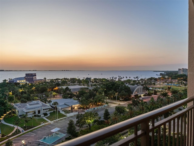 aerial view at dusk with a water view