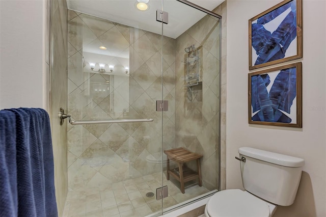 bathroom featuring toilet and walk in shower