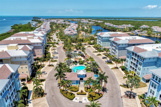 birds eye view of property featuring a water view