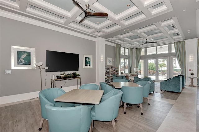 dining space with french doors, coffered ceiling, ceiling fan, beam ceiling, and light hardwood / wood-style floors