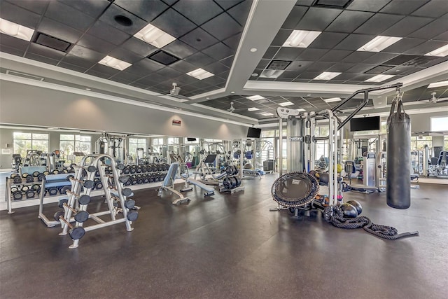 exercise room featuring a paneled ceiling and ceiling fan