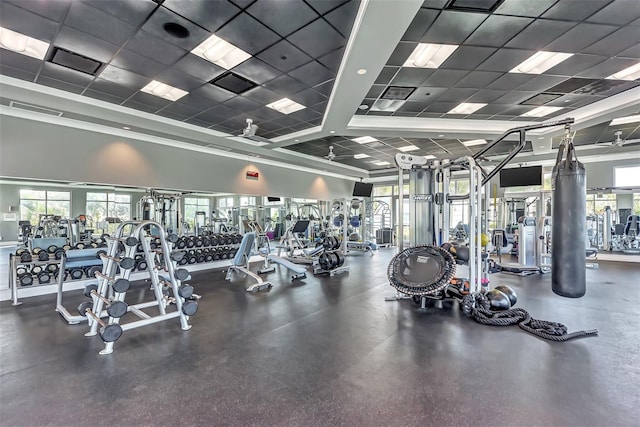 gym with a drop ceiling and ceiling fan