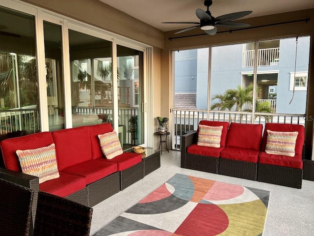 sunroom / solarium featuring ceiling fan