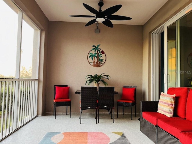 sunroom with ceiling fan and a wealth of natural light