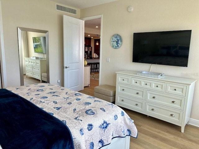 bedroom featuring light hardwood / wood-style floors