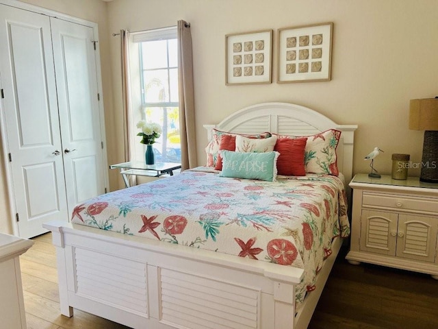 bedroom featuring a closet and hardwood / wood-style flooring