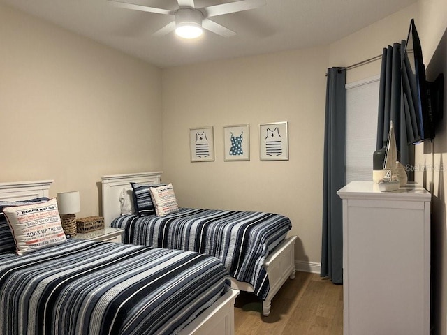 bedroom featuring ceiling fan and light wood-type flooring