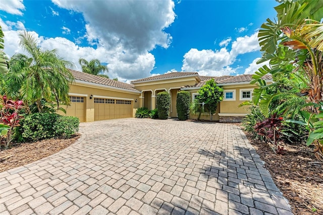 mediterranean / spanish-style home featuring a garage